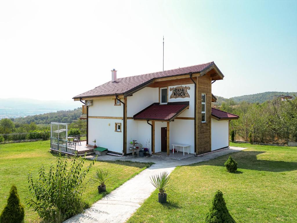Villa Krasi exterior with mountain backdrop
