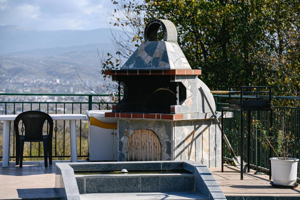 Outdoor stone BBQ with mountain view